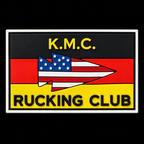 K.M.C. Rucking Club logo with American flag speedboat design on red and yellow background