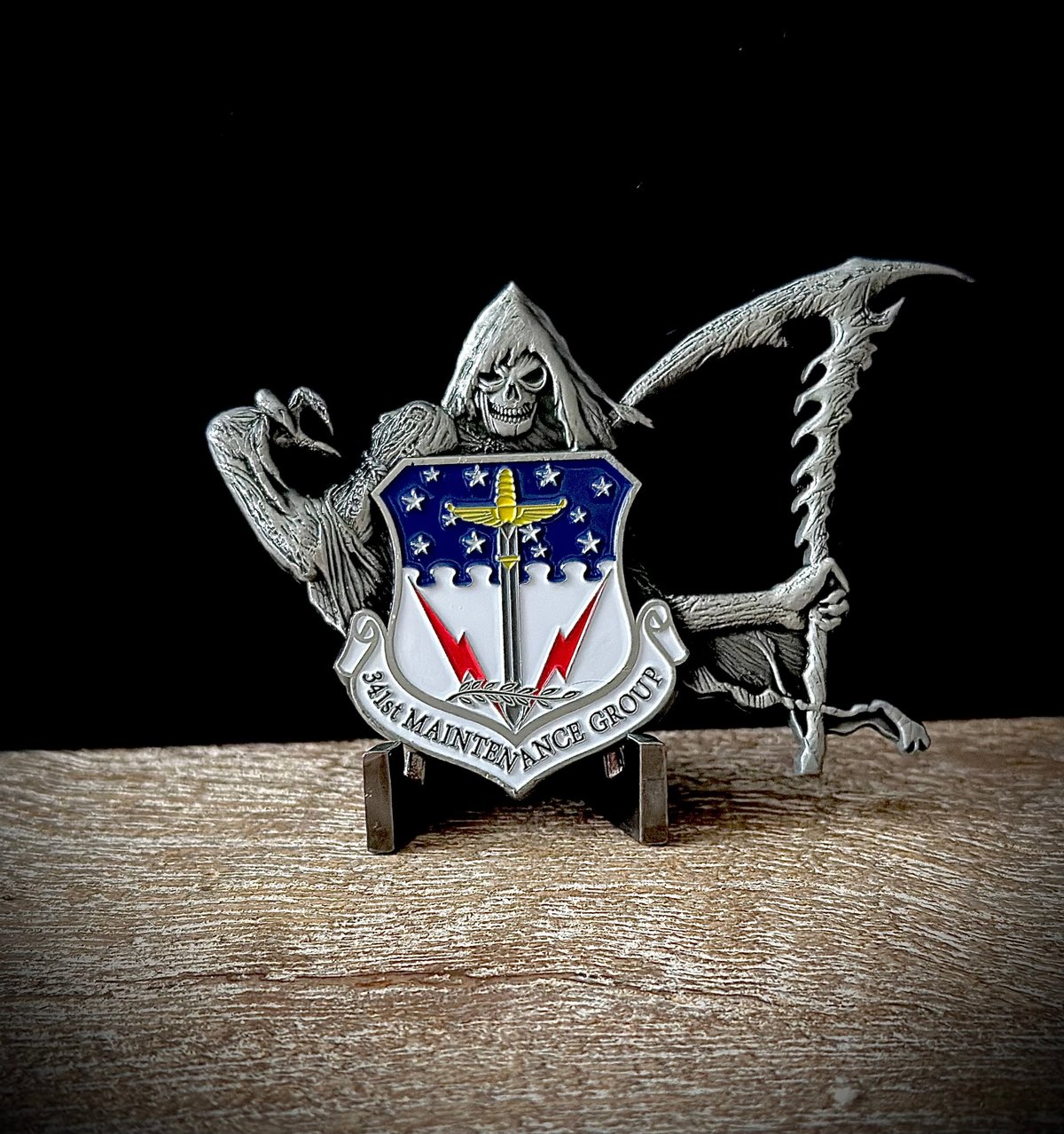 Military emblem with blue and gold design honoring service members